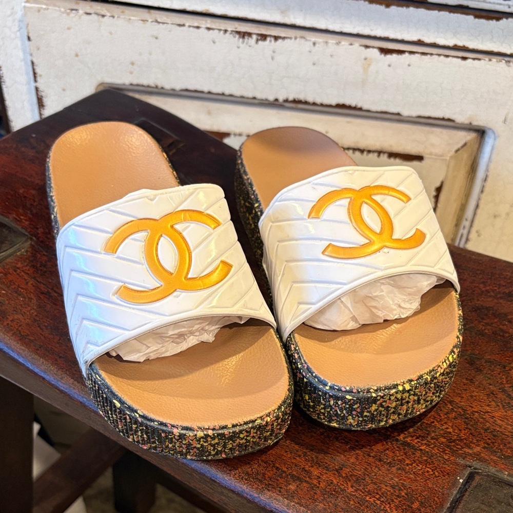 Sandals Feature A Large Gold Interlocking Large L… - image 1